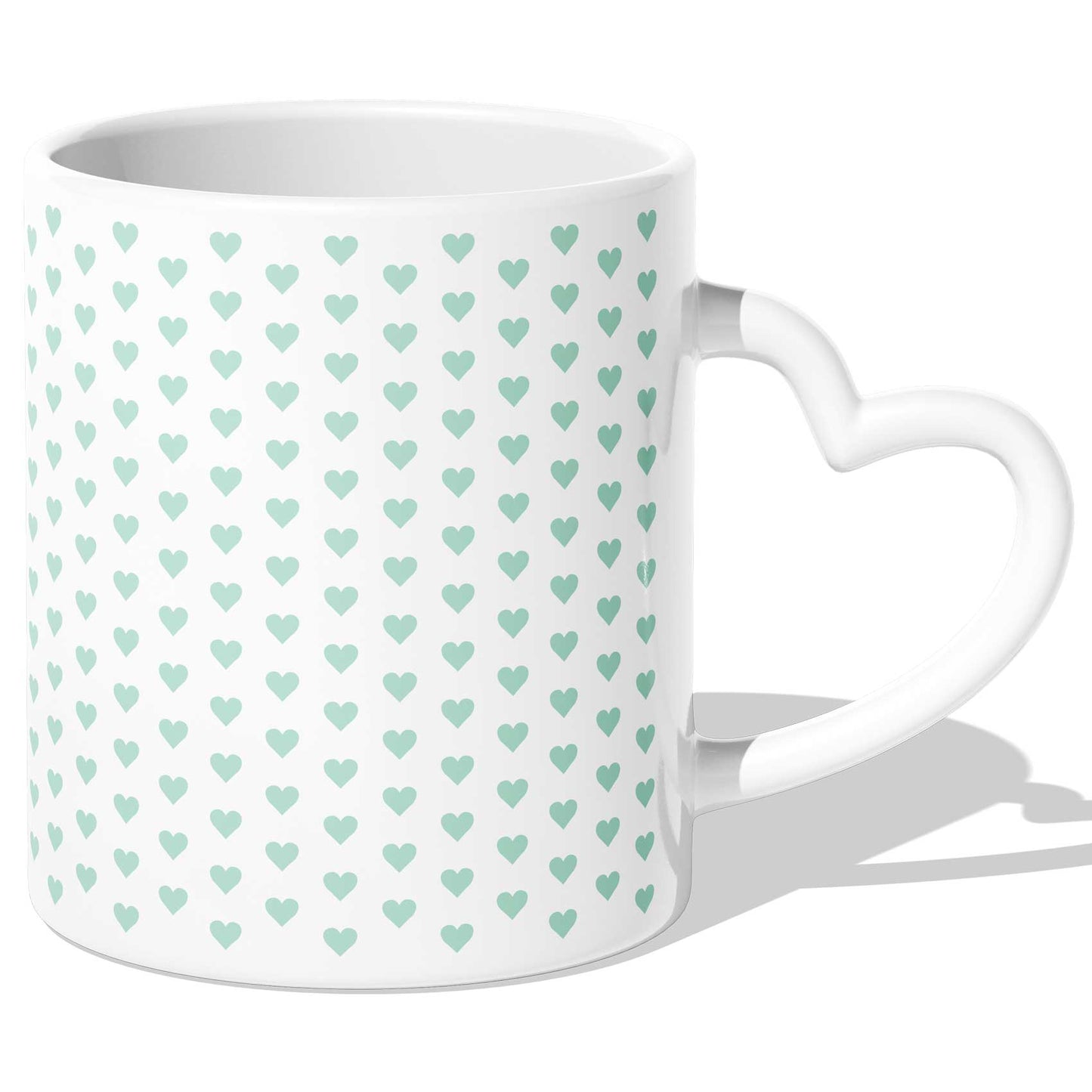 Tasse mit herzförmigem Henkel und grünem Herzmuster, ein charmantes Accessoire für jeden Anlass.