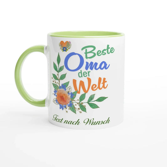 A charming Beste Oma der Welt Tasse from Tasse mit Herz features a green handle and vibrant flowers, customizable with your text, making it an ideal gift for grandma.