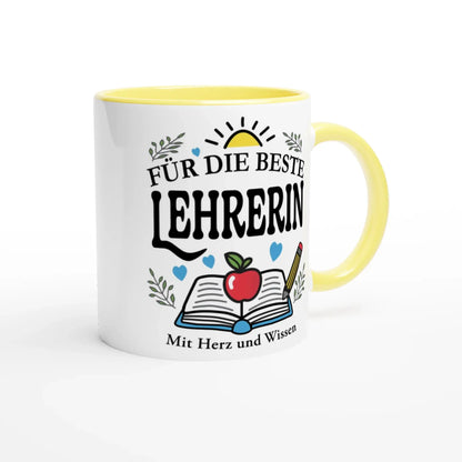 The Tasse „Für die beste Lehrerin“ by Tasse mit Herz features a white exterior, a yellow interior, and German text Für die beste Lehrerin and Mit Herz und Wissen, accompanied by illustrations of a book, apple, pencil, hearts, and sun. Its the perfekte Geschenk für die beste Lehrerin.