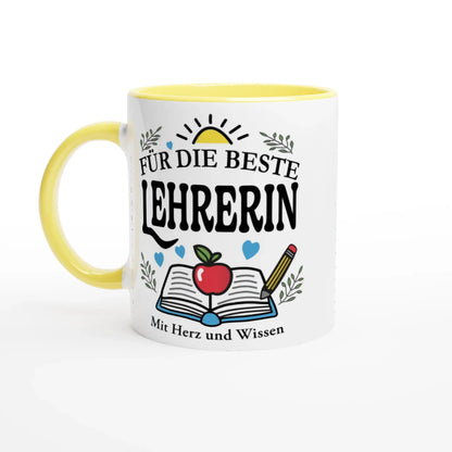 The Tasse „Für die beste Lehrerin“ by Tasse mit Herz is a white cup with a yellow handle, featuring the German text, an open book, apple, and pencil illustration. Decorative leaves and hearts embellish this gift, with the phrase Mit Herz und Wissen at the bottom.