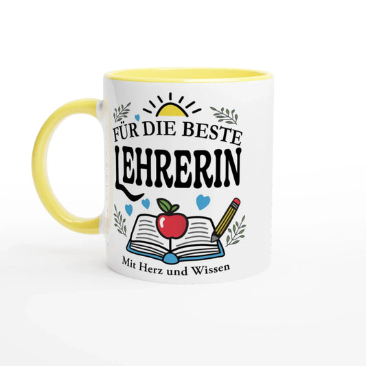 The Tasse „Für die beste Lehrerin“ by Tasse mit Herz is a white cup with a yellow handle, featuring the German text, an open book, apple, and pencil illustration. Decorative leaves and hearts embellish this gift, with the phrase Mit Herz und Wissen at the bottom.